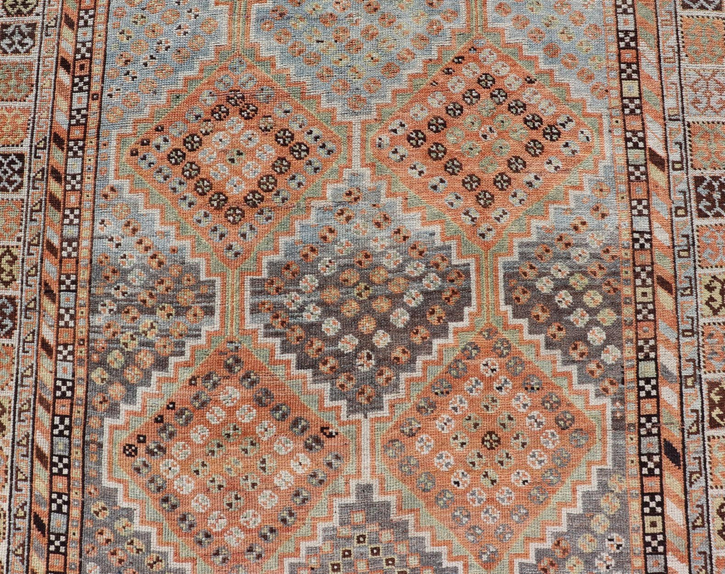 Measures: 4'7 x 8'0 This exquisite antique Shiraz rug features a striking geometric diamond motif, characteristic of the rich weaving tradition of the Shiraz region in southwestern Iran. The central field is adorned with a series of interconnected ... - Keivan Woven ArtsEMB - 22249 - 22520