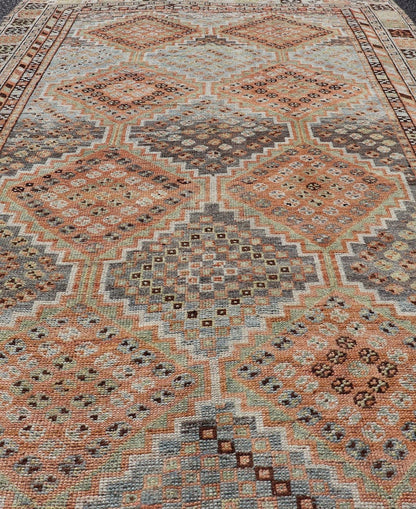 Measures: 4'7 x 8'0 This exquisite antique Shiraz rug features a striking geometric diamond motif, characteristic of the rich weaving tradition of the Shiraz region in southwestern Iran. The central field is adorned with a series of interconnected ... - Keivan Woven ArtsEMB - 22249 - 22520
