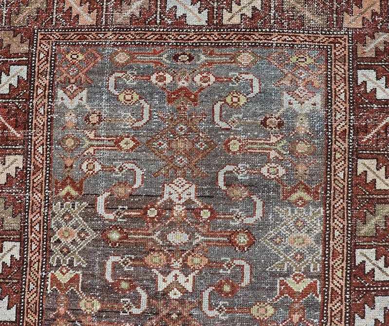 Measures: 3'1 x 9'10 This distinguished antique runner rug hails from the Northwest region of Persia, crafted in the early 20th century. The rug features a captivating central field adorned with intricate geometric and floral motifs in a palette of... - Keivan Woven ArtsEMB - 22257 - 22562