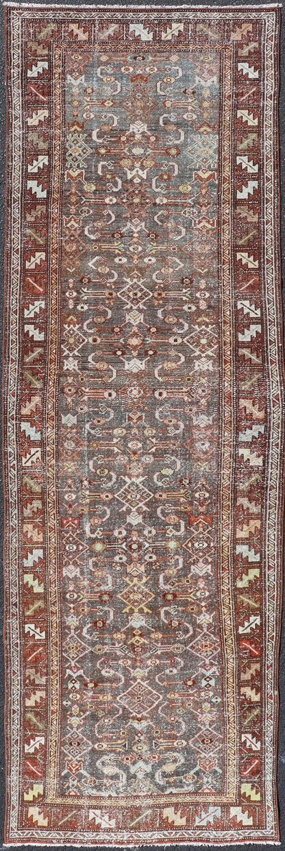 Measures: 3'1 x 9'10 This distinguished antique runner rug hails from the Northwest region of Persia, crafted in the early 20th century. The rug features a captivating central field adorned with intricate geometric and floral motifs in a palette of... - Keivan Woven ArtsEMB - 22257 - 22562