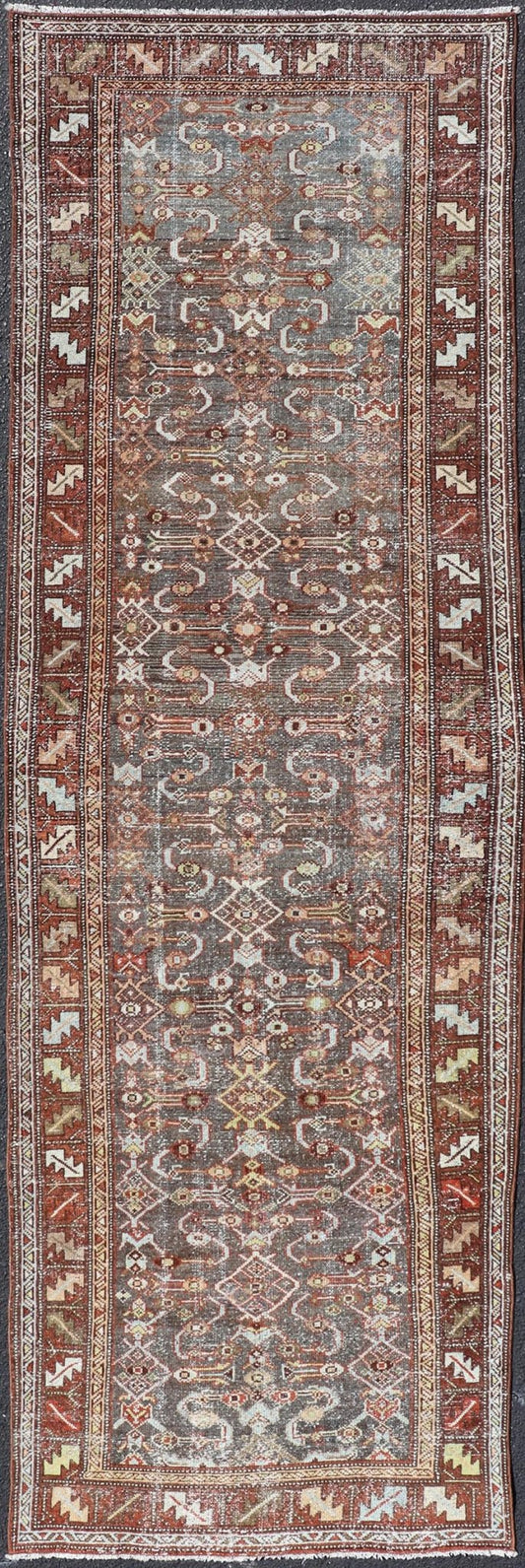 Measures: 3'1 x 9'10 This distinguished antique runner rug hails from the Northwest region of Persia, crafted in the early 20th century. The rug features a captivating central field adorned with intricate geometric and floral motifs in a palette of... - Keivan Woven ArtsEMB - 22257 - 22562