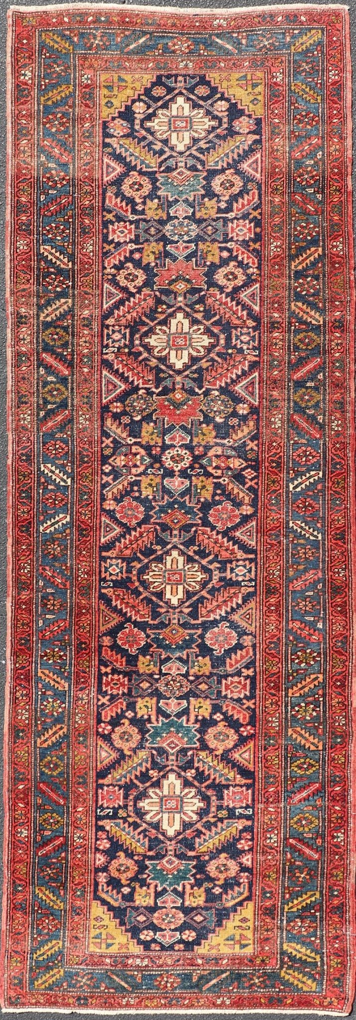 Measures: 3'9 x 11'3 This stunning Serapi runner, an exceptional example of Persian weaving, displays a vibrant and intricate design characteristic of the Serapi style known for its sophistication and complexity. The rug features a rich, dark blue ... - Keivan Woven ArtsEMB - 22258 - 22568