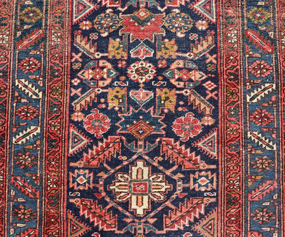 Measures: 3'9 x 11'3 This stunning Serapi runner, an exceptional example of Persian weaving, displays a vibrant and intricate design characteristic of the Serapi style known for its sophistication and complexity. The rug features a rich, dark blue ... - Keivan Woven ArtsEMB - 22258 - 22568