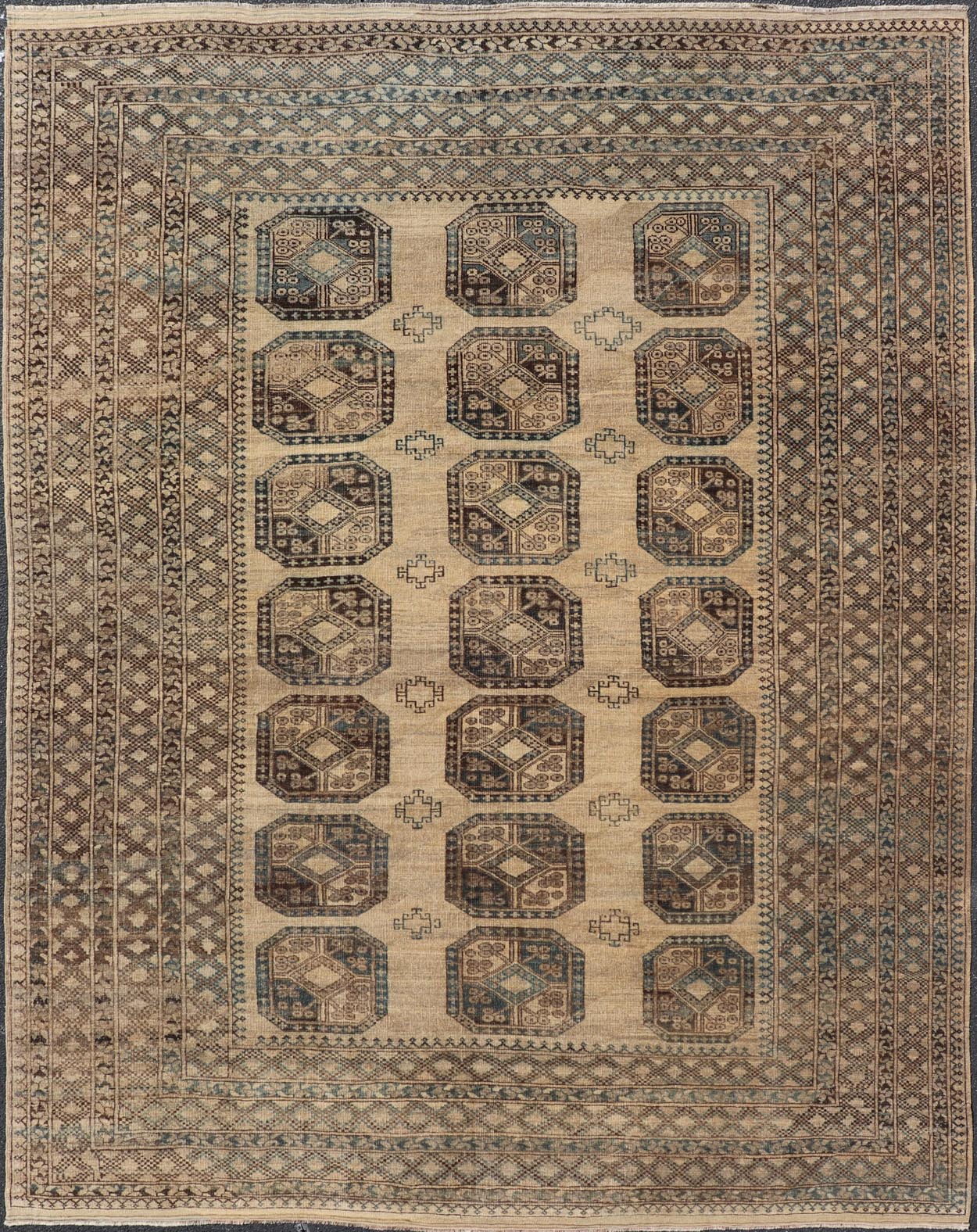 Measures: 8'7 x 11'10 This antique Ersari rug captures the essence of traditional tribal artistry, characterized by its structured array of medallions and rich, earthy tones. The rug features a series of octagonal medallions aligned in a formal, or... - Keivan Woven ArtsEMB - 22279 - 26100Rug