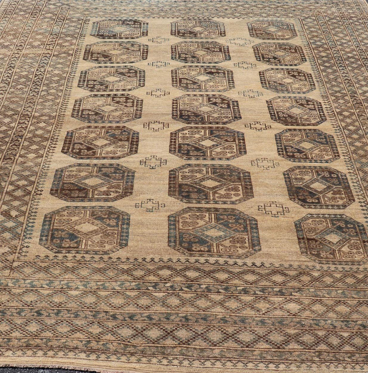 Measures: 8'7 x 11'10 This antique Ersari rug captures the essence of traditional tribal artistry, characterized by its structured array of medallions and rich, earthy tones. The rug features a series of octagonal medallions aligned in a formal, or... - Keivan Woven ArtsEMB - 22279 - 26100Rug