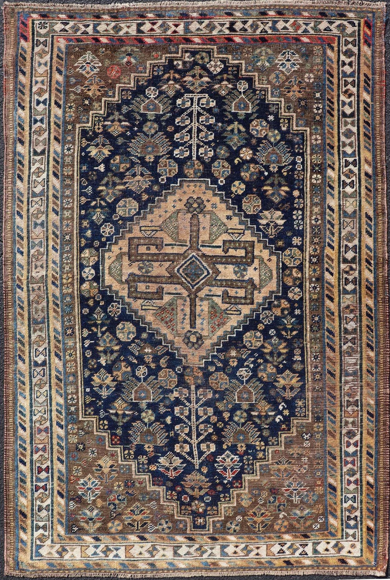 Measures: 3'6 x 5'4 This magnificent antique Persian Shiraz rug is a stunning example of traditional tribal craftsmanship. The rug is dominated by a deep navy field that beautifully contrasts with the rich array of tribal motifs and symbols in vibr... - Keivan Woven ArtsEMB - 22282 - 26106Rug