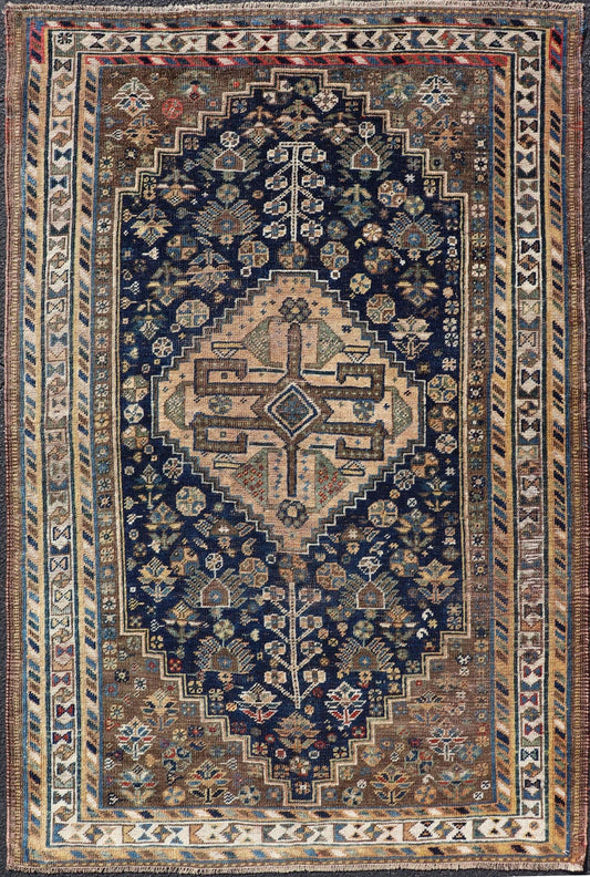 Measures: 3'6 x 5'4 This magnificent antique Persian Shiraz rug is a stunning example of traditional tribal craftsmanship. The rug is dominated by a deep navy field that beautifully contrasts with the rich array of tribal motifs and symbols in vibr... - Keivan Woven ArtsEMB - 22282 - 26106Rug