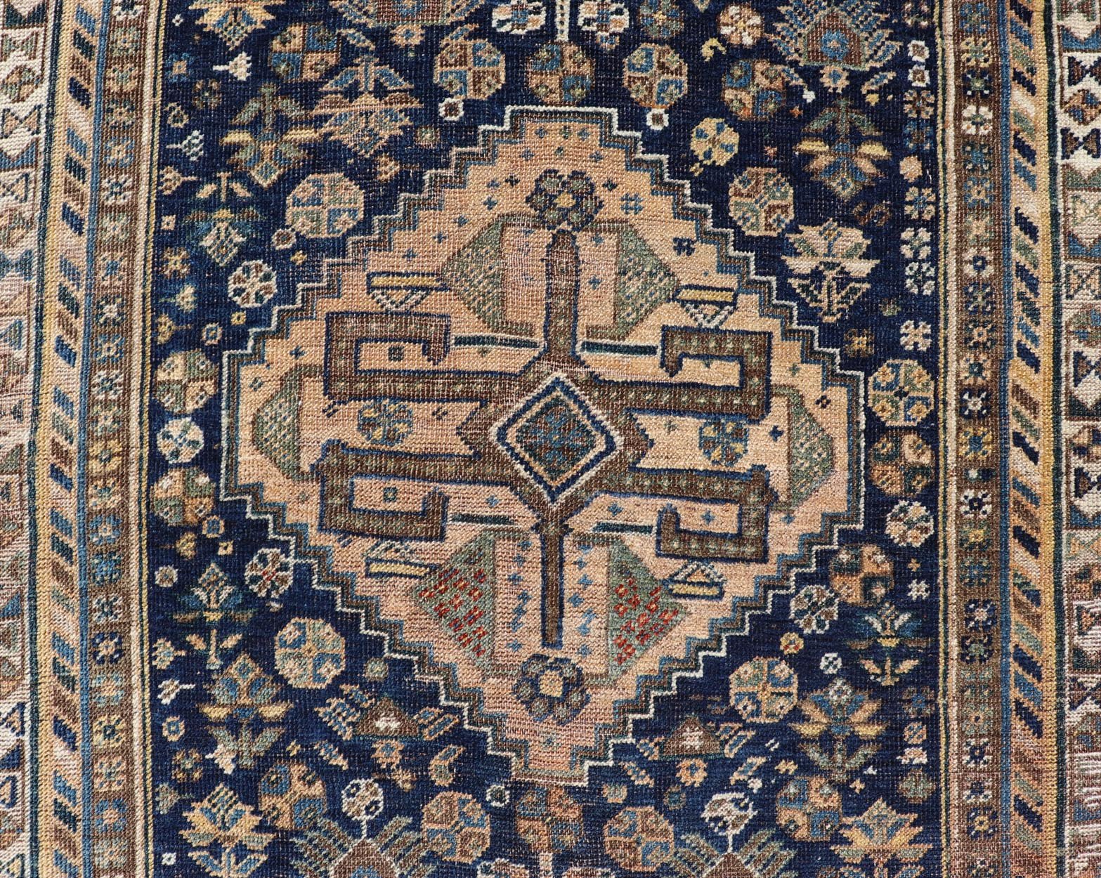 Measures: 3'6 x 5'4 This magnificent antique Persian Shiraz rug is a stunning example of traditional tribal craftsmanship. The rug is dominated by a deep navy field that beautifully contrasts with the rich array of tribal motifs and symbols in vibr... - Keivan Woven ArtsEMB - 22282 - 26106Rug