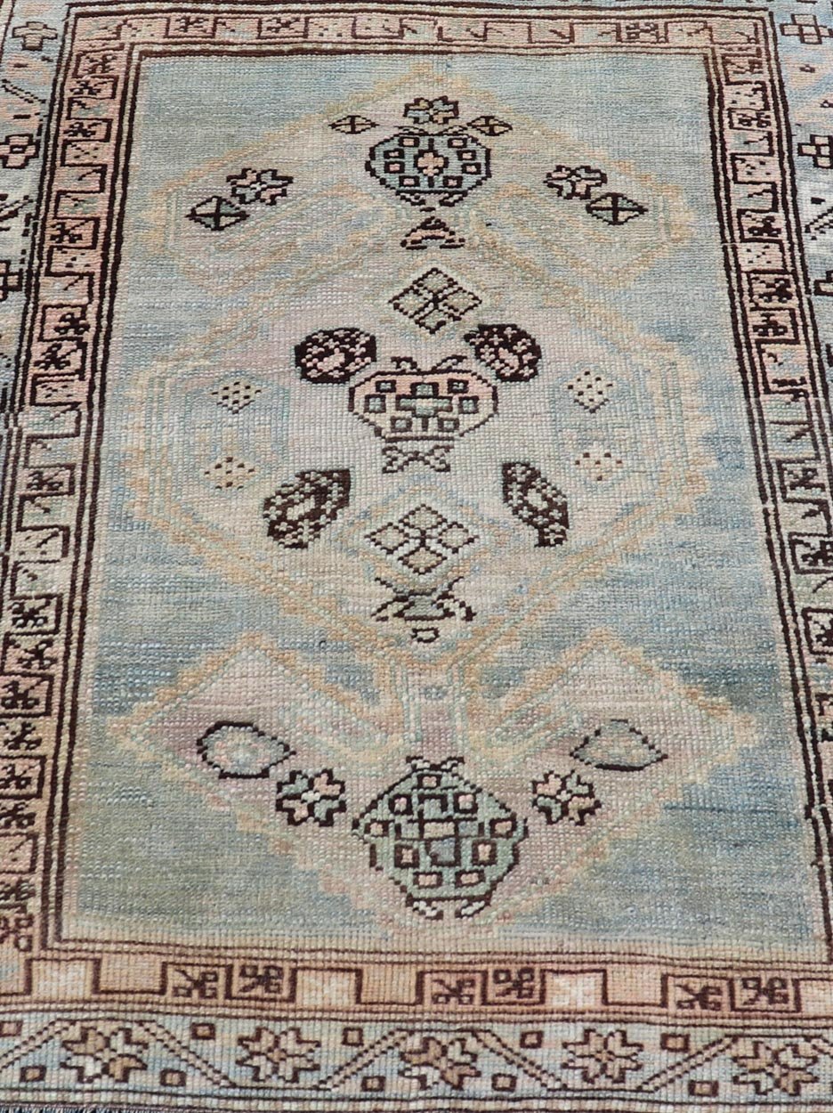 Measures: 3'0 x 4'5 This refined antique Persian Kurdish rug showcases a sophisticated blend of geometric designs and subtle color palette, exemplifying the understated beauty of Kurdish weaving. The rug features a serene light blue field that sets... - Keivan Woven ArtsEMB - 22286 - 26772
