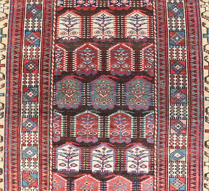 Measures: 3'3 x 8'4 This stunning antique Persian Kurdish runner showcases a vibrant and intricate design, reflecting the rich tribal heritage of Kurdish craftsmanship. The rug features a series of repeated medallions, each intricately detailed wit... - Keivan Woven ArtsEMB - 22288 - 26124Rug