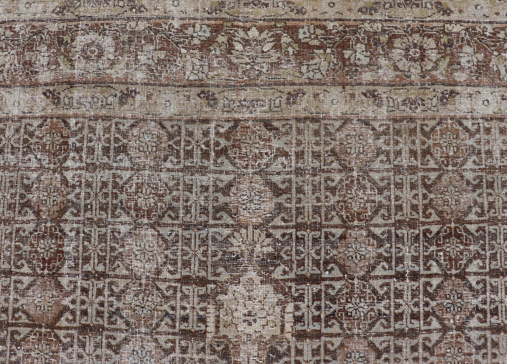 Antique Hand - Knotted Distressed Persian Mahal Rug in Wool with Medallion Design This antique distressed Persian Mahal rug has been hand - knotted in wool and features a large medallion design rendered in muted tones, a complementary, multi - tiered... - Keivan Woven ArtsEMB - 5000 - P13060 - 16406Rug