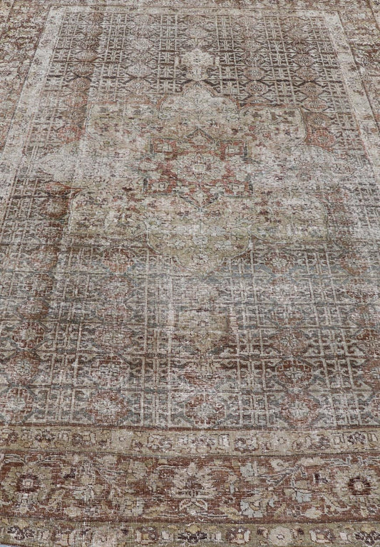 Antique Hand - Knotted Distressed Persian Mahal Rug in Wool with Medallion Design This antique distressed Persian Mahal rug has been hand - knotted in wool and features a large medallion design rendered in muted tones, a complementary, multi - tiered... - Keivan Woven ArtsEMB - 5000 - P13060 - 16406Rug