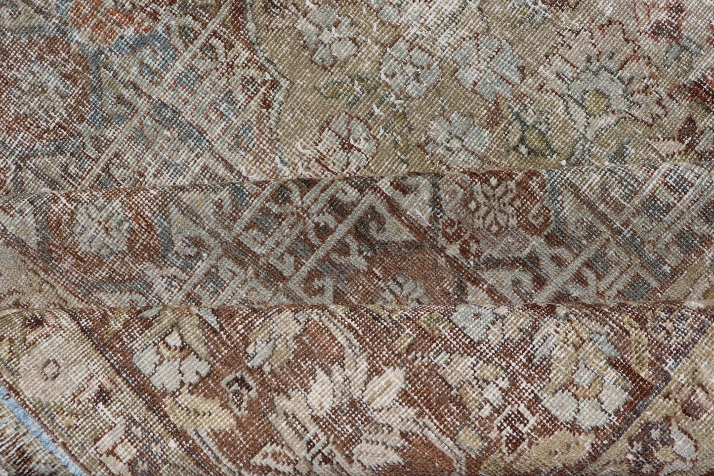 Antique Hand - Knotted Distressed Persian Mahal Rug in Wool with Medallion Design This antique distressed Persian Mahal rug has been hand - knotted in wool and features a large medallion design rendered in muted tones, a complementary, multi - tiered... - Keivan Woven ArtsEMB - 5000 - P13060 - 16406Rug