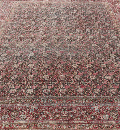 Antique Persian Khorasan Rug with Floral Design in Charcoal, Brown & Rose Red. Distressed Persian Rug Antique distressed rug. distressed antique rug Large Antique Persian Khorasan rug with floral design in charcoal background and, red pink. Keiv... - Keivan Woven ArtsEMB - 8502 - 178037 - 13618Rug