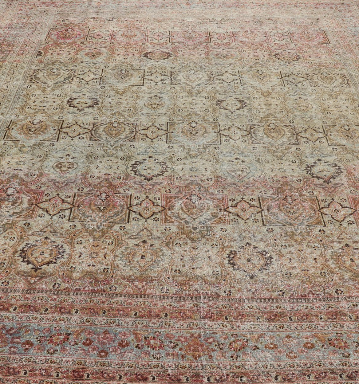 Distressed Antique Persian Khorassan Rug with Palmettes, Geometric Flowers in Soft Tones Distressed Antique Persian Khorassan Rug with Stretched Palmettes and Vining Flowers, Keivan Woven Arts rug/EMB - 8503, origin/ Iran. Colors include light g... - Keivan Woven ArtsEMB - 8503 - 178039 - 13624Rug