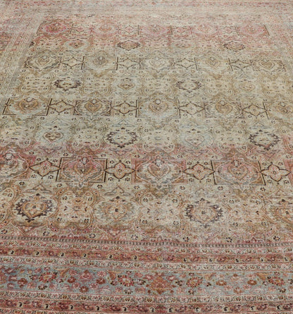 Distressed Antique Persian Khorassan Rug with Palmettes, Geometric Flowers in Soft Tones Distressed Antique Persian Khorassan Rug with Stretched Palmettes and Vining Flowers, Keivan Woven Arts rug/EMB - 8503, origin/ Iran. Colors include light g... - Keivan Woven ArtsEMB - 8503 - 178039 - 13624Rug