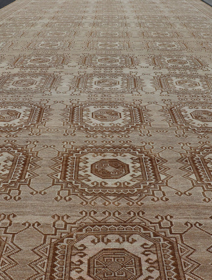 Vintage Hand - Knotted Turkman Rug with Repeating Sub - Geometric Octagonal Design This vintage hand - knotted Turkman rug features an all - over repeating sub - geometric octagonal design, rendered in ivory and earthy tones; making this rug a perfect fi... - Keivan Woven ArtsEMB - 8517 - 178547 - 13756Rug