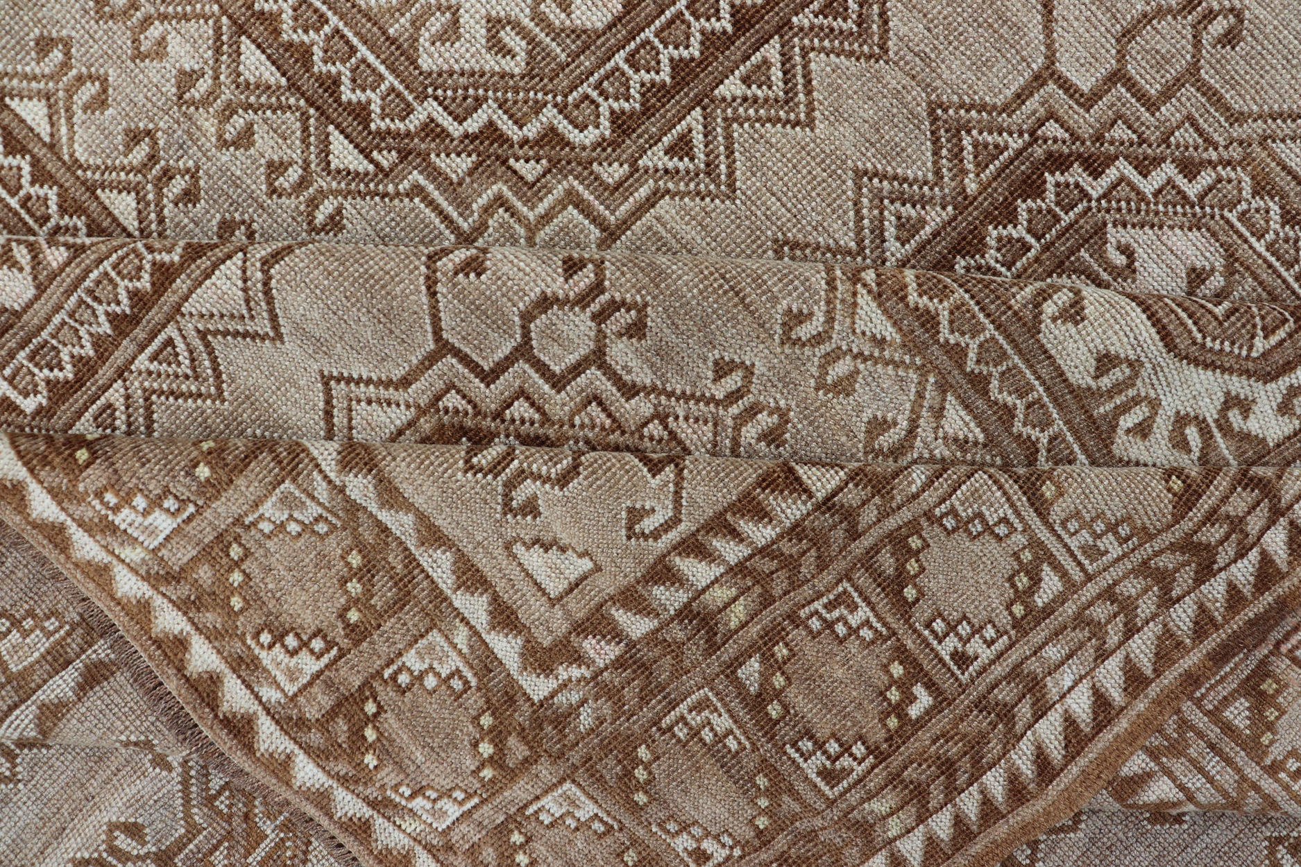 Vintage Hand - Knotted Turkman Rug with Repeating Sub - Geometric Octagonal Design This vintage hand - knotted Turkman rug features an all - over repeating sub - geometric octagonal design, rendered in ivory and earthy tones; making this rug a perfect fi... - Keivan Woven ArtsEMB - 8517 - 178547 - 13756Rug