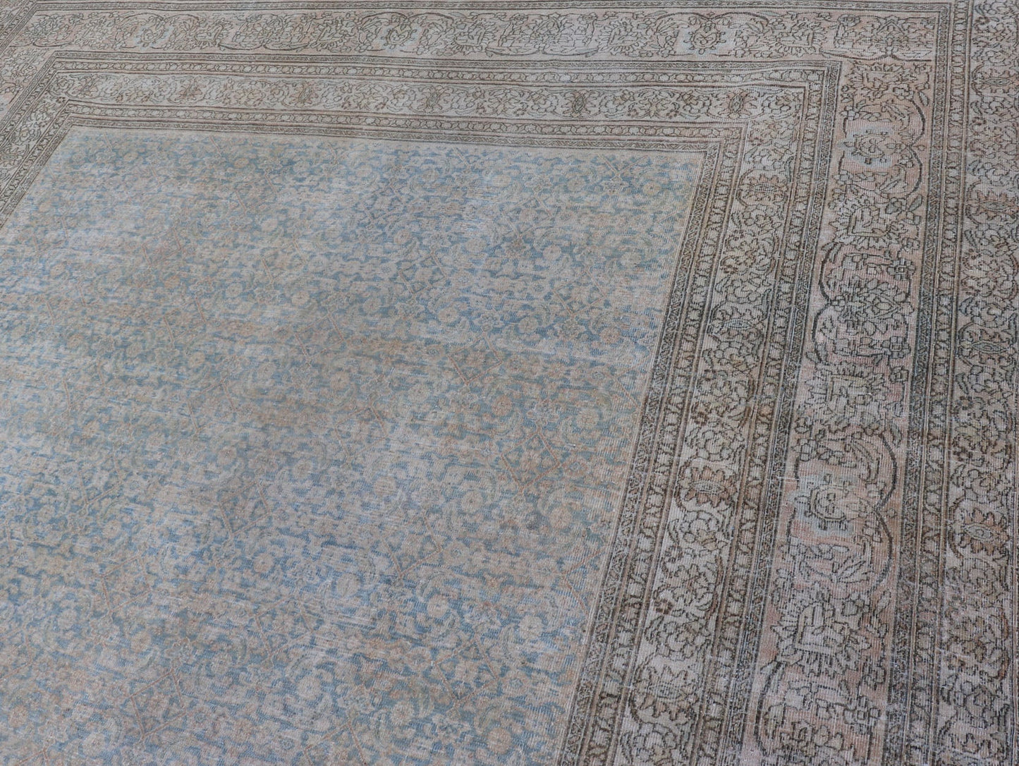 Antique Hand - Knotted Persian Mashad Rug with Sub - Geometric Floral & Diamond Design This antique hand - knotted Persian Mashad rug features a sub - geometric diamond design placed upon an all - over floral pattern and is enclosed within a complementary... - Keivan Woven ArtsEMB - 8520 - 178548 - 13760Rug