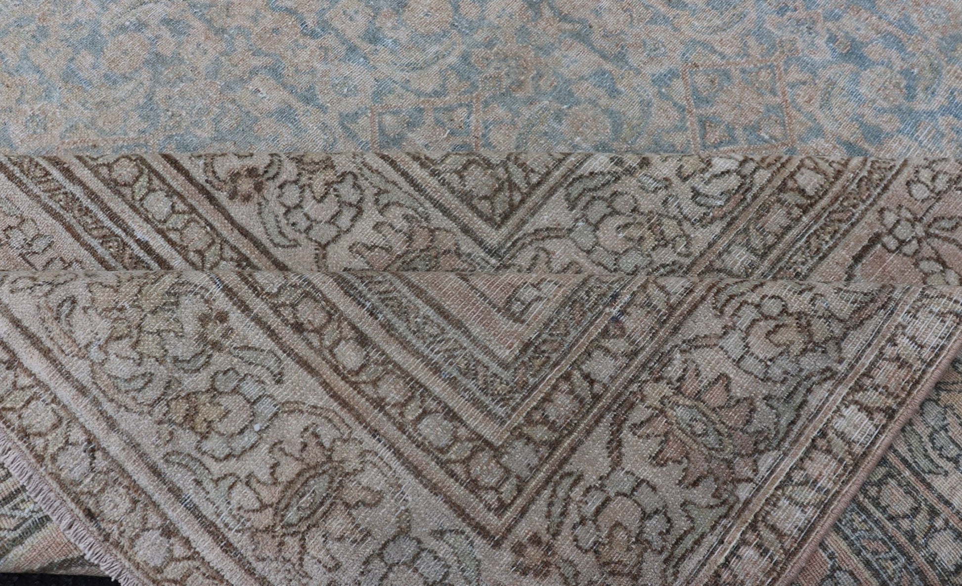 Antique Hand - Knotted Persian Mashad Rug with Sub - Geometric Floral & Diamond Design This antique hand - knotted Persian Mashad rug features a sub - geometric diamond design placed upon an all - over floral pattern and is enclosed within a complementary... - Keivan Woven ArtsEMB - 8520 - 178548 - 13760Rug