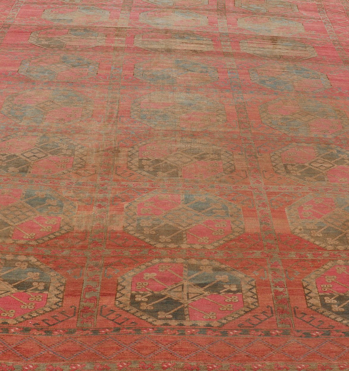 Large Turkomen Ersari Rug with All - Over Gul Design in Tan, Coral, and Brown. Antique Persian Ersari/ Turkomen rug in coral/red tones with geometric motifs. Keivan Woven Arts / rug EMB - 8522 - 178691, Turkomen, circa 1930. Measures: 10'4 x 15'6 This... - Keivan Woven ArtsEMB - 8522 - 178691 - 13668Rug
