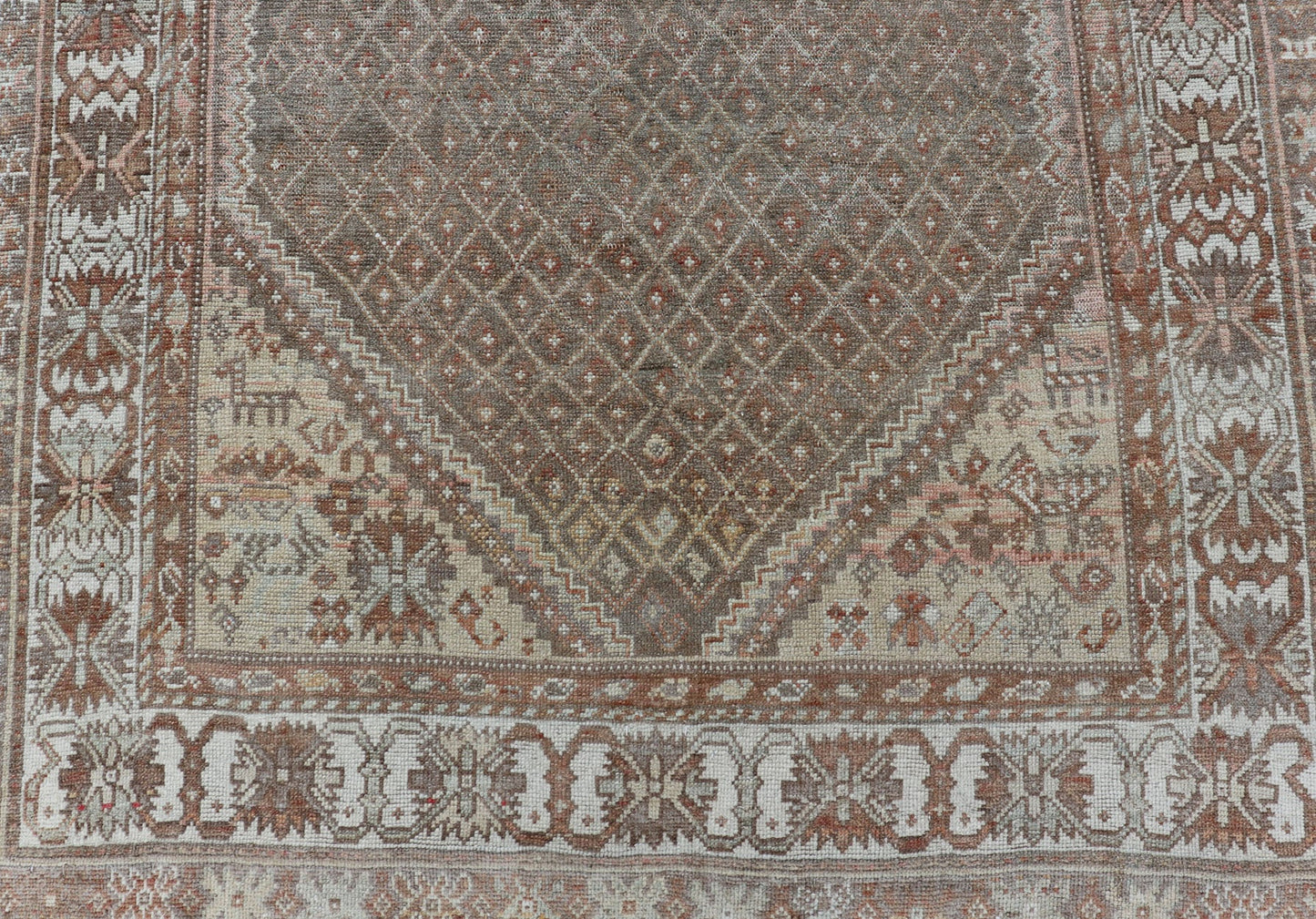 distressed Antique Persian Kurdish Rug in Gray/Brown Background with Taupe Tan & Soft Red. Softly colored antique distressed Persian Kurdish with all - over tribal design in soft colors of gray, charcoal, brown, tan cream, green , rug EMB - 8529 - 17... - Keivan Woven ArtsEMB - 8529 - 178682 - 13696Rug
