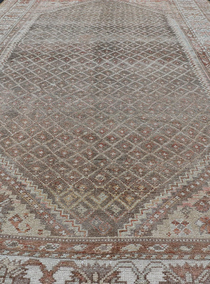 distressed Antique Persian Kurdish Rug in Gray/Brown Background with Taupe Tan & Soft Red. Softly colored antique distressed Persian Kurdish with all - over tribal design in soft colors of gray, charcoal, brown, tan cream, green , rug EMB - 8529 - 17... - Keivan Woven ArtsEMB - 8529 - 178682 - 13696Rug