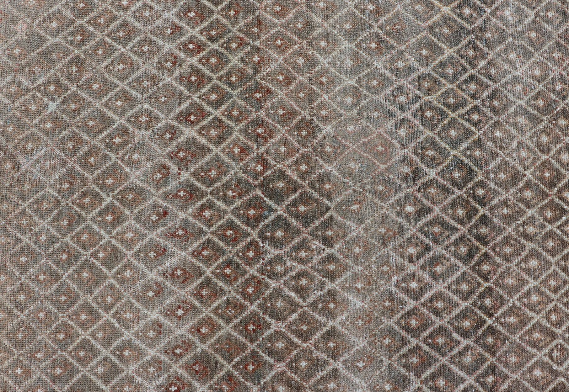 distressed Antique Persian Kurdish Rug in Gray/Brown Background with Taupe Tan & Soft Red. Softly colored antique distressed Persian Kurdish with all - over tribal design in soft colors of gray, charcoal, brown, tan cream, green , rug EMB - 8529 - 17... - Keivan Woven ArtsEMB - 8529 - 178682 - 13696Rug