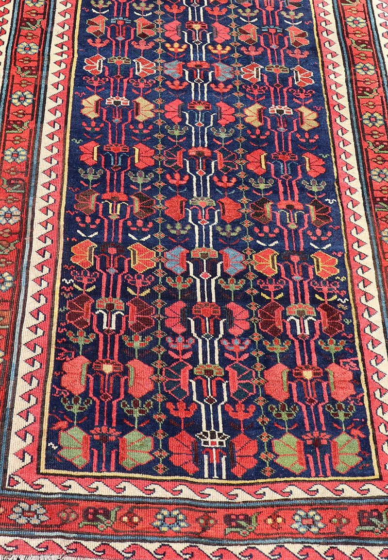 This antique runner was woven in the mountainous region of Caucasus, given much time for details in the field of a perfectly symmetrical all - over design. The field many colors of green, yellow, light blue, ivory and brown. The midnight blue background ... - Keivan Woven ArtsEMB - 8537 - 13778Rug