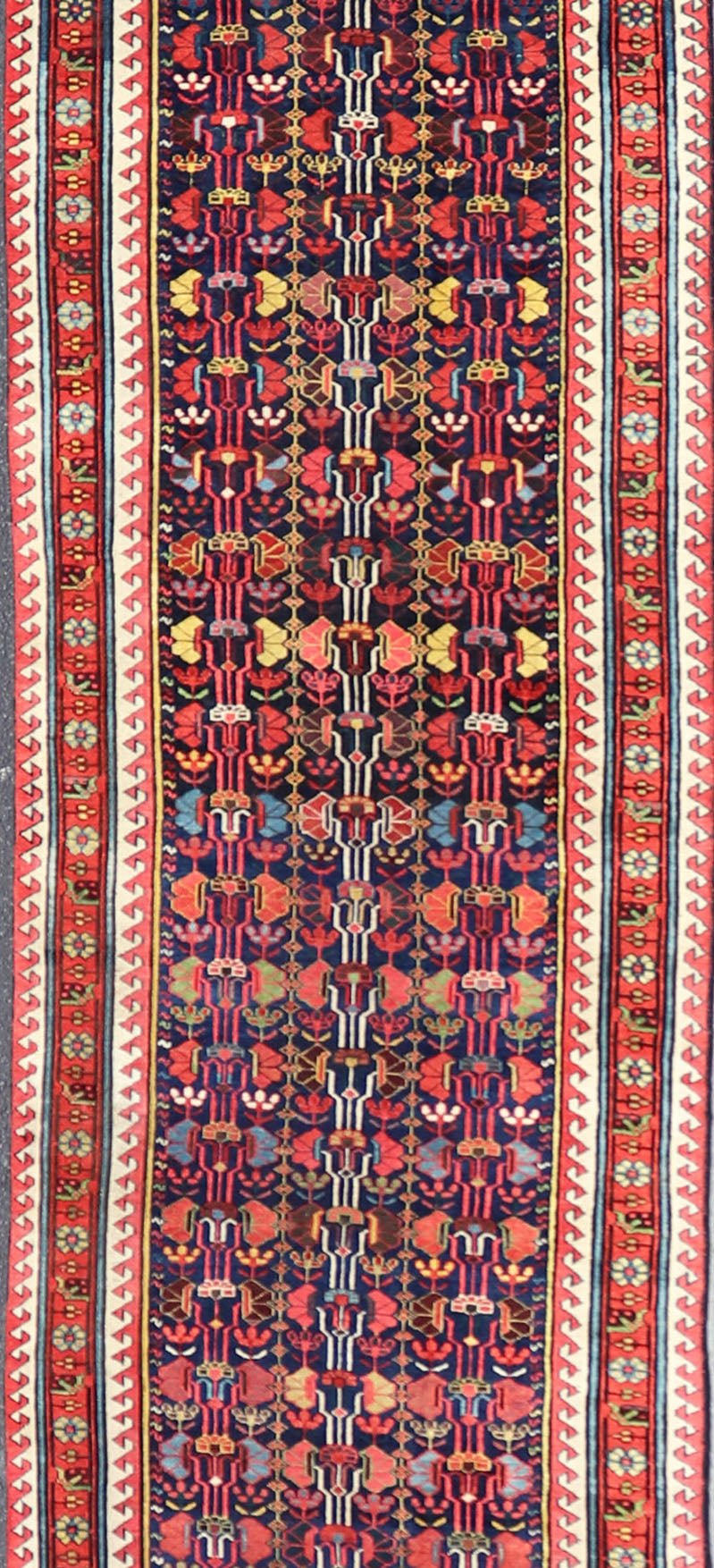 This antique runner was woven in the mountainous region of Caucasus, given much time for details in the field of a perfectly symmetrical all - over design. The field many colors of green, yellow, light blue, ivory and brown. The midnight blue background ... - Keivan Woven ArtsEMB - 8537 - 13778Rug