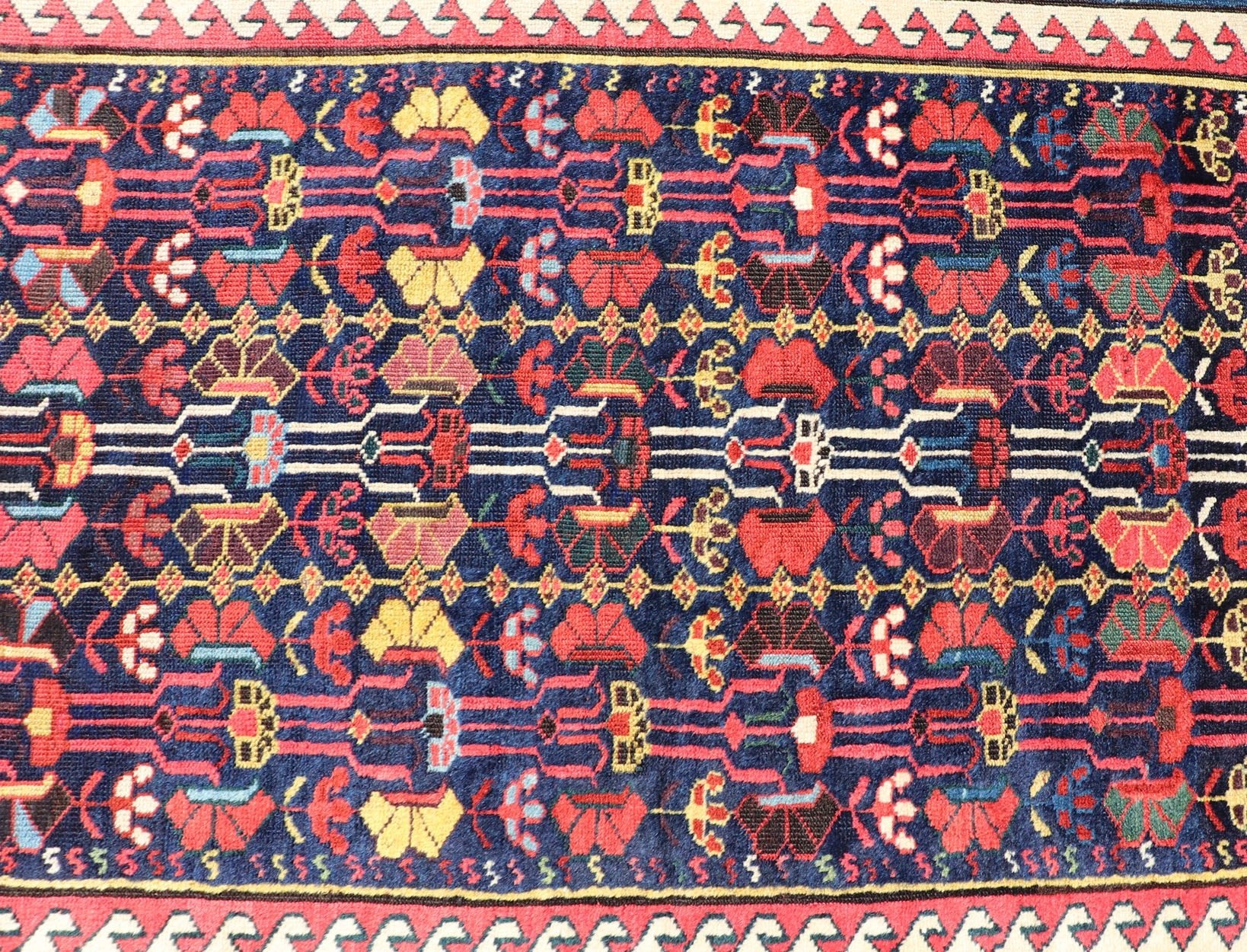This antique runner was woven in the mountainous region of Caucasus, given much time for details in the field of a perfectly symmetrical all - over design. The field many colors of green, yellow, light blue, ivory and brown. The midnight blue background ... - Keivan Woven ArtsEMB - 8537 - 13778Rug