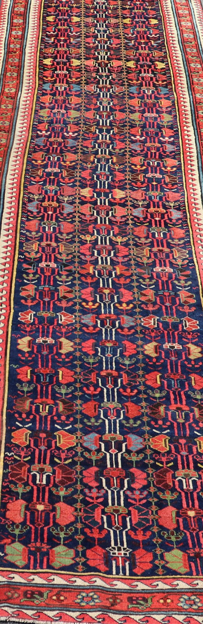 This antique runner was woven in the mountainous region of Caucasus, given much time for details in the field of a perfectly symmetrical all - over design. The field many colors of green, yellow, light blue, ivory and brown. The midnight blue background ... - Keivan Woven ArtsEMB - 8537 - 13778Rug