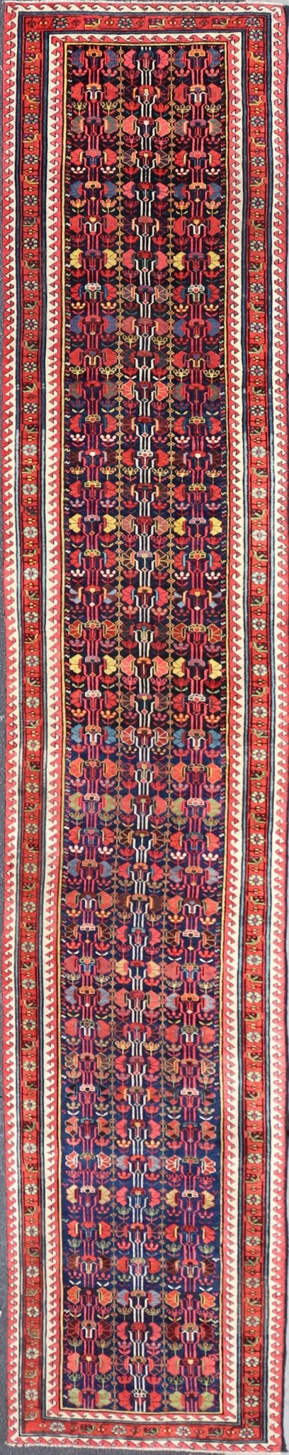 This antique runner was woven in the mountainous region of Caucasus, given much time for details in the field of a perfectly symmetrical all - over design. The field many colors of green, yellow, light blue, ivory and brown. The midnight blue background ... - Keivan Woven ArtsEMB - 8537 - 13778Rug