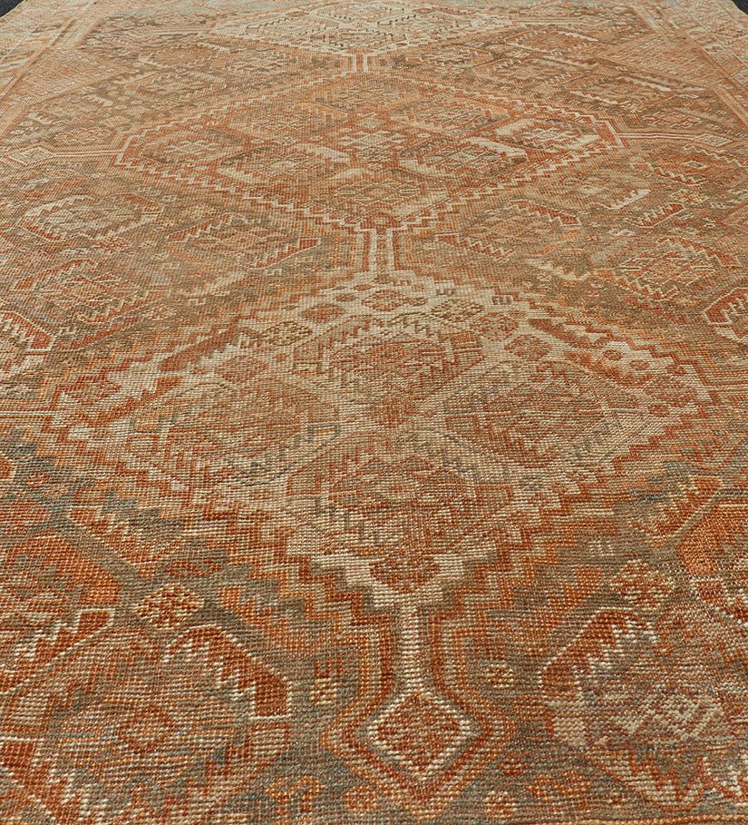Antique Distressed Persian Shiraz Rug in Shades of Soft Orange, Lt. Brown, Gray. Persian antique Shiraz carpet in soft orange, light gray, light rust red and light brown with geometric medallions, rug EMB - 8545 - 06, country of origin / type: Iran... - Keivan Woven ArtsEMB - 8545 - 06 - 13806Rug