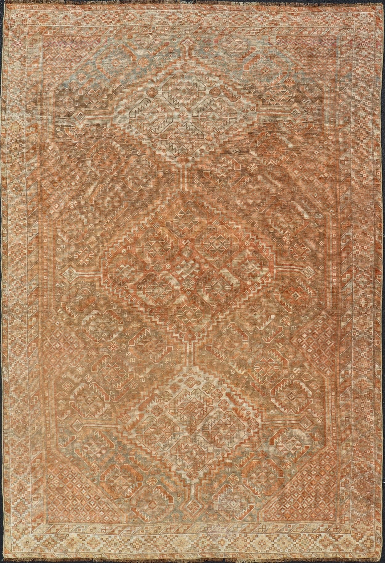 Antique Distressed Persian Shiraz Rug in Shades of Soft Orange, Lt. Brown, Gray. Persian antique Shiraz carpet in soft orange, light gray, light rust red and light brown with geometric medallions, rug EMB - 8545 - 06, country of origin / type: Iran... - Keivan Woven ArtsEMB - 8545 - 06 - 13806Rug