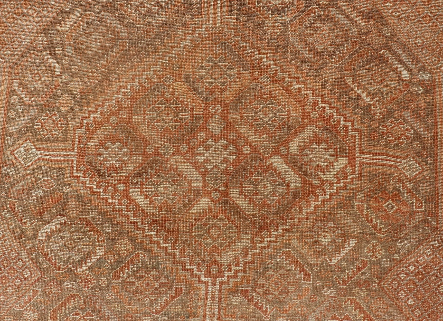 Antique Distressed Persian Shiraz Rug in Shades of Soft Orange, Lt. Brown, Gray. Persian antique Shiraz carpet in soft orange, light gray, light rust red and light brown with geometric medallions, rug EMB - 8545 - 06, country of origin / type: Iran... - Keivan Woven ArtsEMB - 8545 - 06 - 13806Rug