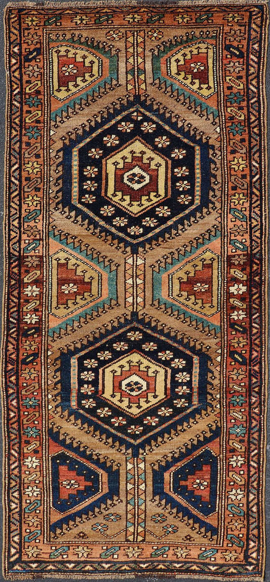 Antique Persian Kurdish Short Runner on Geometric Motifs in Light Camel Field. Medallion design on camel field, with dark blue medallions, green, red, blue , rug EMB - 8546 - 178695, country of origin / type: Iran / Hamedan, circa 1910 This ... - Keivan Woven ArtsEMB - 8546 - 178695 - 13812Rug