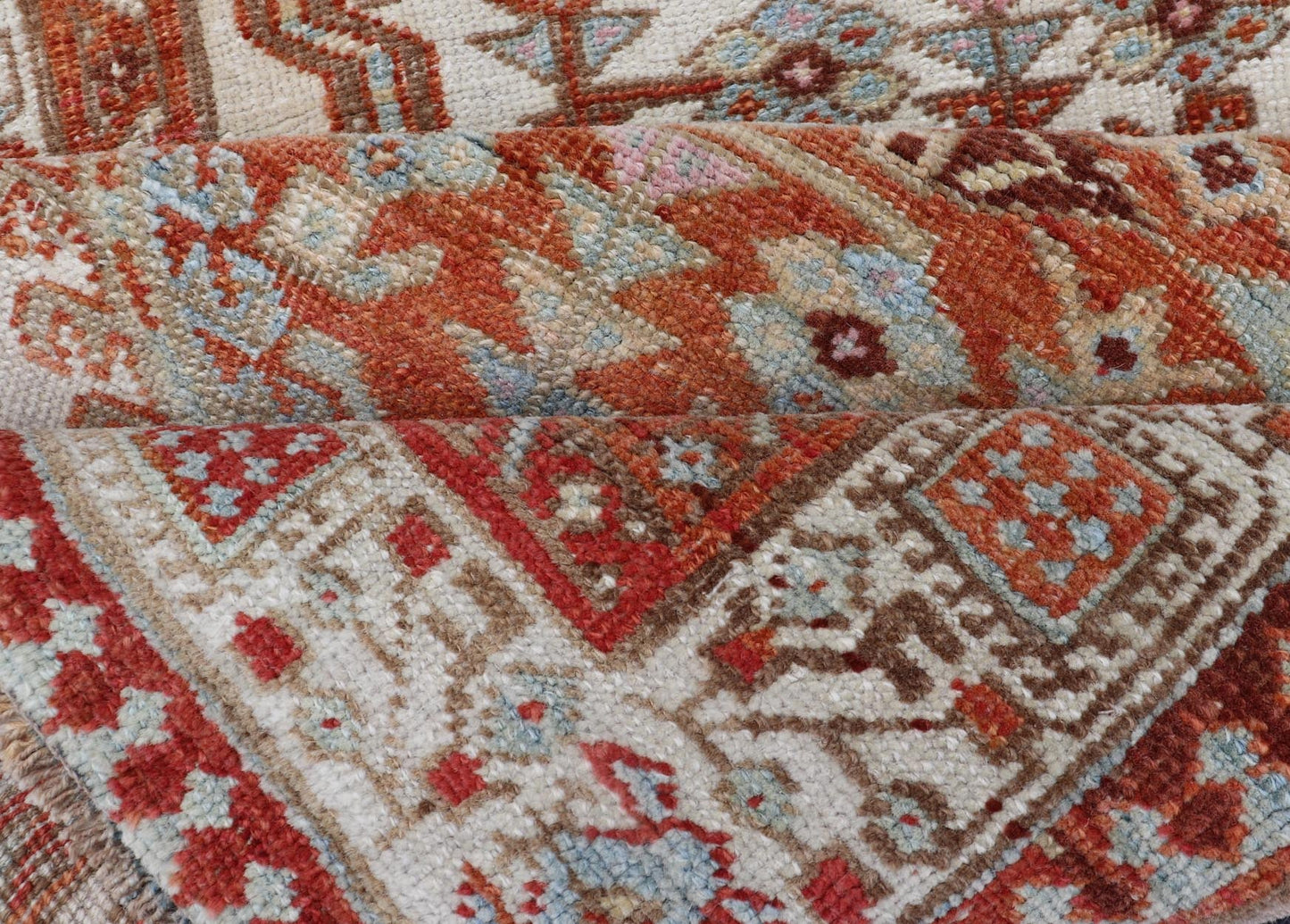 Antique Hand - Knotted Sarab Runner with Sub - Geometric Design in Red, Blue & Ivory This antique hand - knotted Sarab runner features a sub - geometric design accentuated by various motifs. The entirety of the piece is enclosed within a complementary,... - Keivan Woven ArtsEMB - 8548 - 178963 - 13818Rug