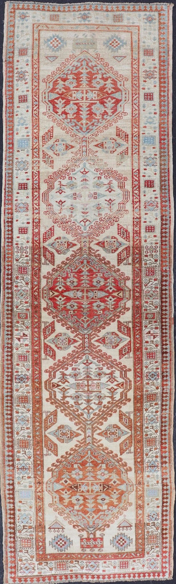 Antique Hand - Knotted Sarab Runner with Sub - Geometric Design in Red, Blue & Ivory This antique hand - knotted Sarab runner features a sub - geometric design accentuated by various motifs. The entirety of the piece is enclosed within a complementary,... - Keivan Woven ArtsEMB - 8548 - 178963 - 13818Rug