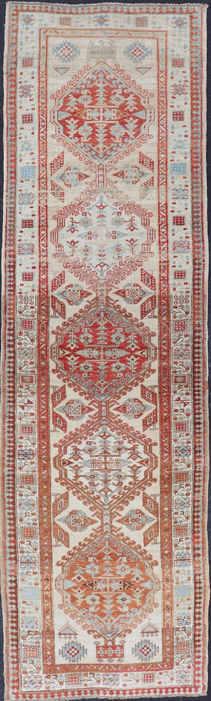 Antique Hand - Knotted Sarab Runner with Sub - Geometric Design in Red, Blue & Ivory This antique hand - knotted Sarab runner features a sub - geometric design accentuated by various motifs. The entirety of the piece is enclosed within a complementary,... - Keivan Woven ArtsEMB - 8548 - 178963 - 13818Rug