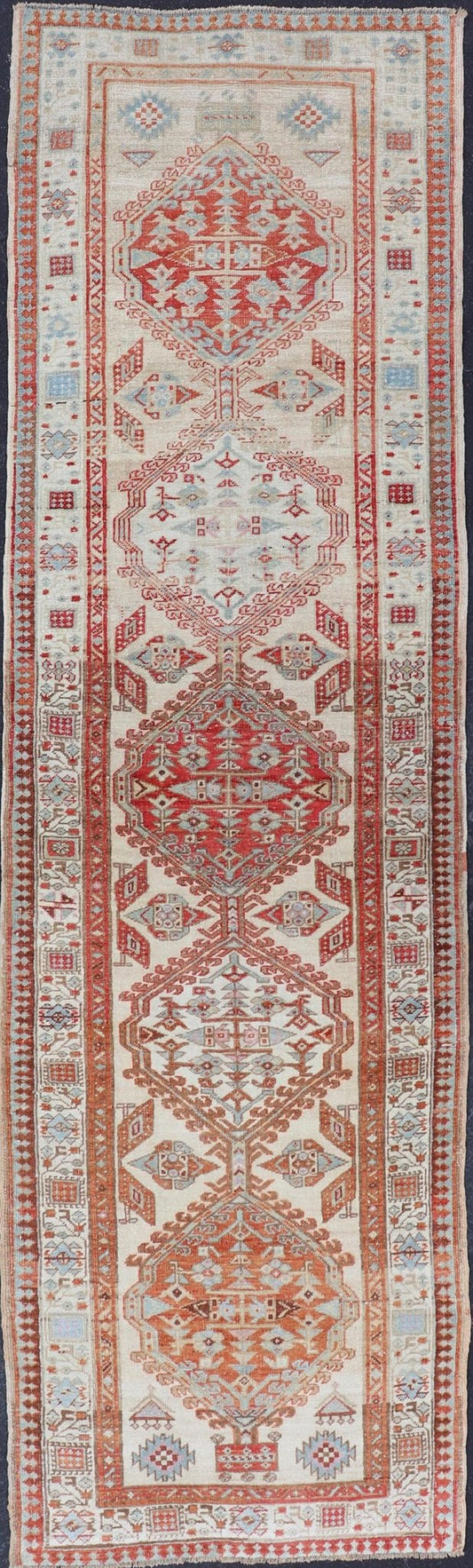 Antique Hand - Knotted Sarab Runner with Sub - Geometric Design in Red, Blue & Ivory This antique hand - knotted Sarab runner features a sub - geometric design accentuated by various motifs. The entirety of the piece is enclosed within a complementary,... - Keivan Woven ArtsEMB - 8548 - 178963 - 13818Rug