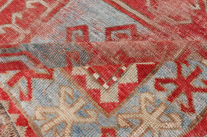 This antique Kazak hand - knotted rug features a geometric double box design and is enclosed within a complementary, multi - tiered border. The rug is rendered in blue, green, cream, red and brown tones; making this rug a perfect fit for a variety of class... - Keivan Woven ArtsEMB - 8552 - 178968 - 13830Rug