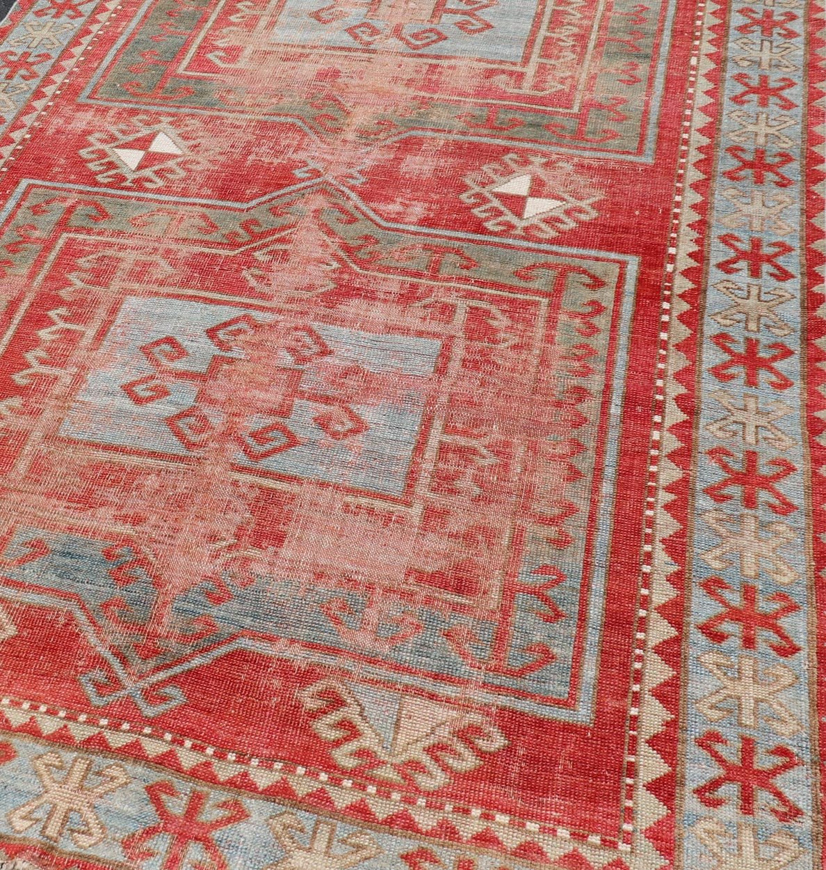 This antique Kazak hand - knotted rug features a geometric double box design and is enclosed within a complementary, multi - tiered border. The rug is rendered in blue, green, cream, red and brown tones; making this rug a perfect fit for a variety of class... - Keivan Woven ArtsEMB - 8552 - 178968 - 13830Rug