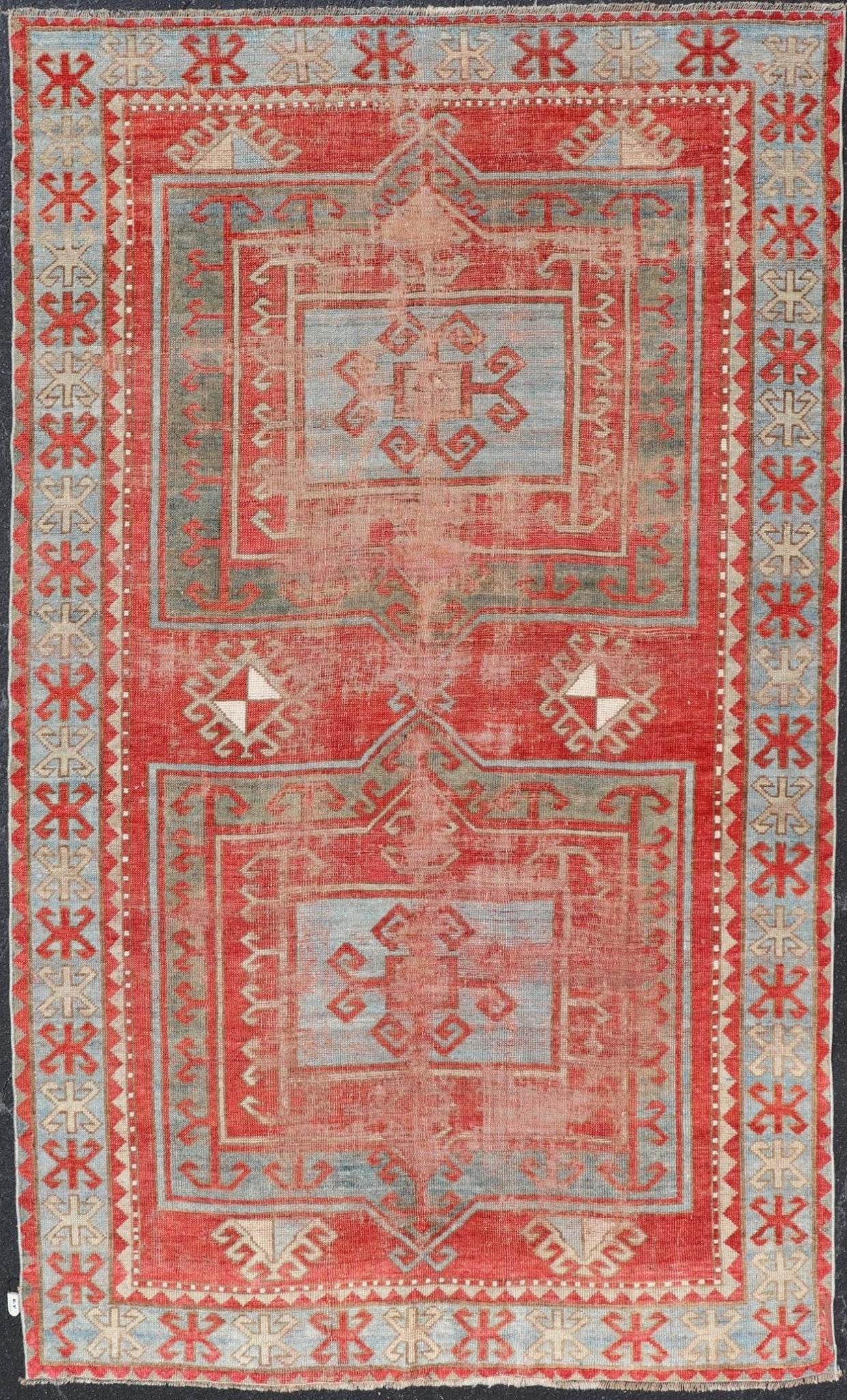 This antique Kazak hand - knotted rug features a geometric double box design and is enclosed within a complementary, multi - tiered border. The rug is rendered in blue, green, cream, red and brown tones; making this rug a perfect fit for a variety of class... - Keivan Woven ArtsEMB - 8552 - 178968 - 13830Rug