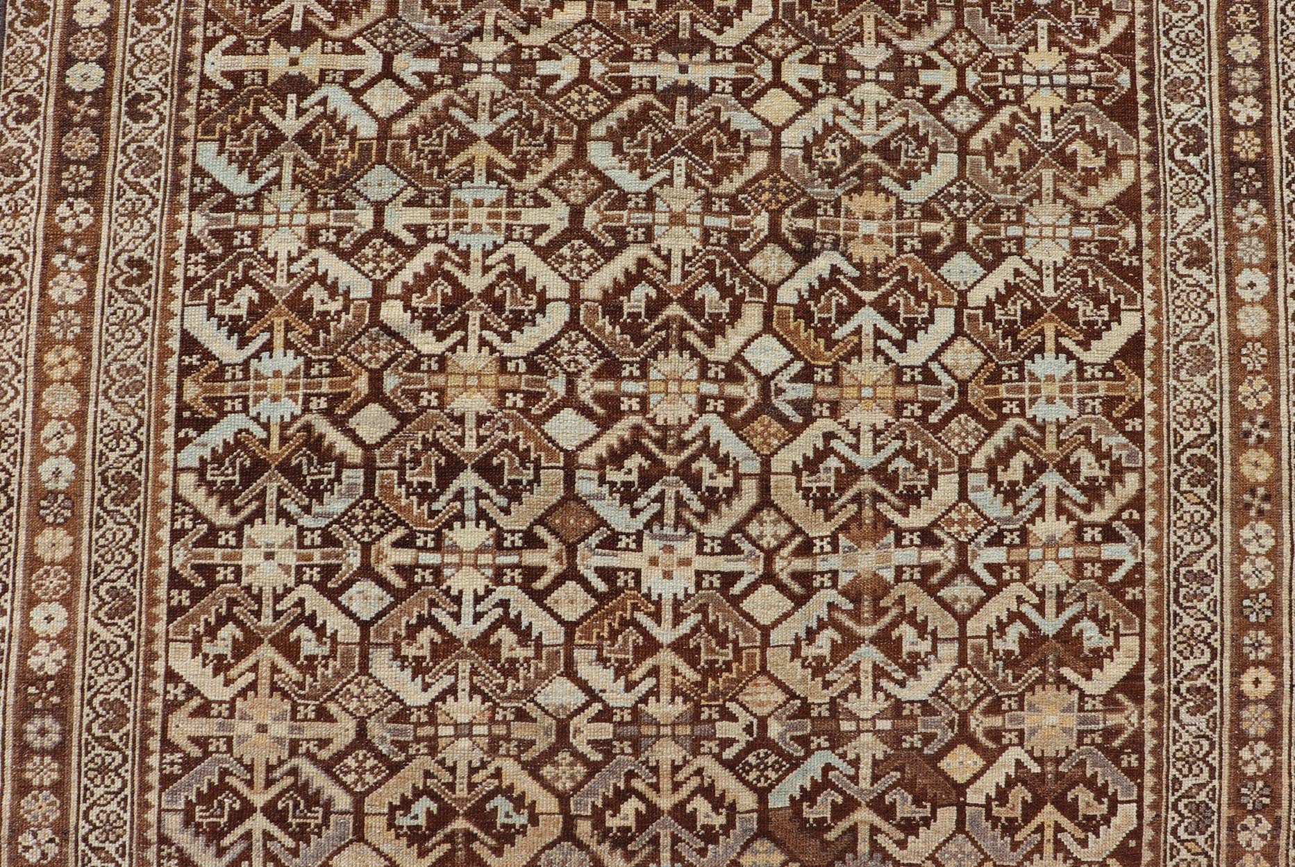 Kurdish Antique Gallery Runner with All - Over Tribal Design in Browns and Blue Antique Kurdish Gallery runner with all - over tribal geometric motifs. Keivan Woven Arts / rug EMB - 9501 - P13063, country of origin / type: Iran / Kurdish, circa 1920.... - Keivan Woven ArtsEMB - 9501 - P13063 - 14542Rug