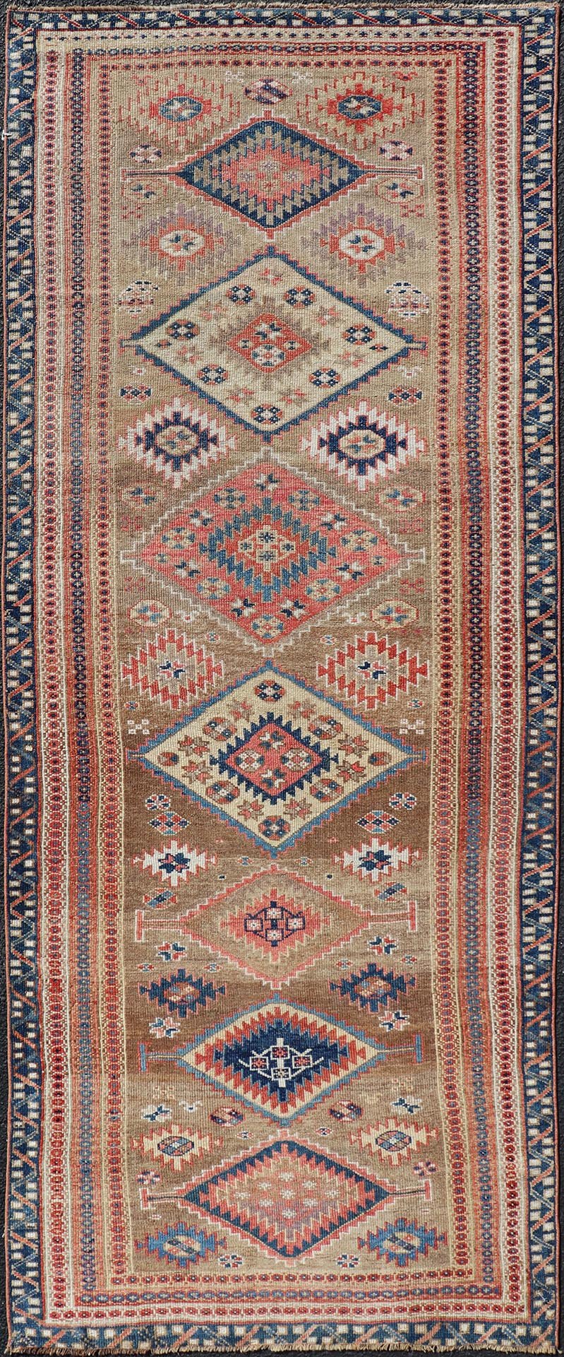 Antique Persian Kurdish Short Runner With Geometric Motifs in Light Camel Field Antique Persian Kurdish Short Runner With Geometric Motifs in Light Camel Field Medallion design on camel field, dark blue, red, ivory, and camel. Keivan Woven A... - Keivan Woven ArtsEMB - 9505 - P13067 - 14608Rug