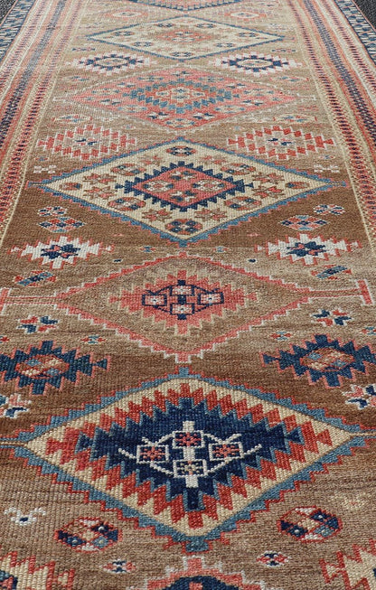 Antique Persian Kurdish Short Runner With Geometric Motifs in Light Camel Field Antique Persian Kurdish Short Runner With Geometric Motifs in Light Camel Field Medallion design on camel field, dark blue, red, ivory, and camel. Keivan Woven A... - Keivan Woven ArtsEMB - 9505 - P13067 - 14608Rug