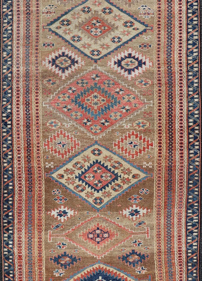 Antique Persian Kurdish Short Runner With Geometric Motifs in Light Camel Field Antique Persian Kurdish Short Runner With Geometric Motifs in Light Camel Field Medallion design on camel field, dark blue, red, ivory, and camel. Keivan Woven A... - Keivan Woven ArtsEMB - 9505 - P13067 - 14608Rug
