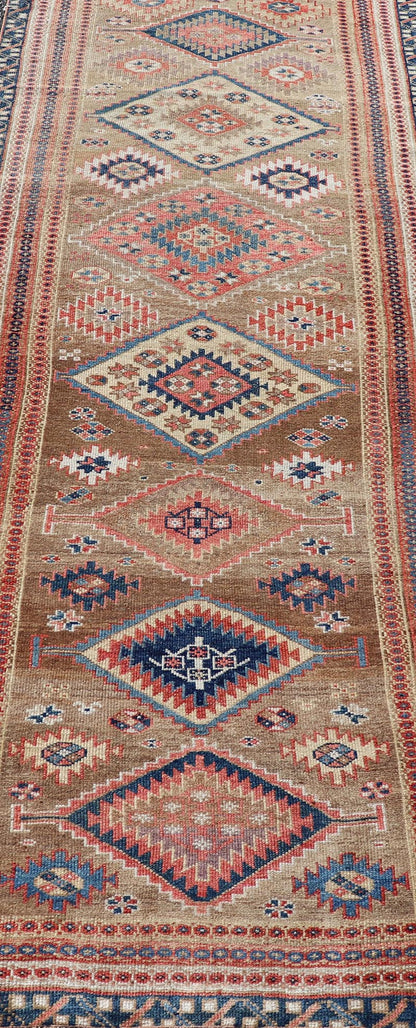 Antique Persian Kurdish Short Runner With Geometric Motifs in Light Camel Field Antique Persian Kurdish Short Runner With Geometric Motifs in Light Camel Field Medallion design on camel field, dark blue, red, ivory, and camel. Keivan Woven A... - Keivan Woven ArtsEMB - 9505 - P13067 - 14608Rug