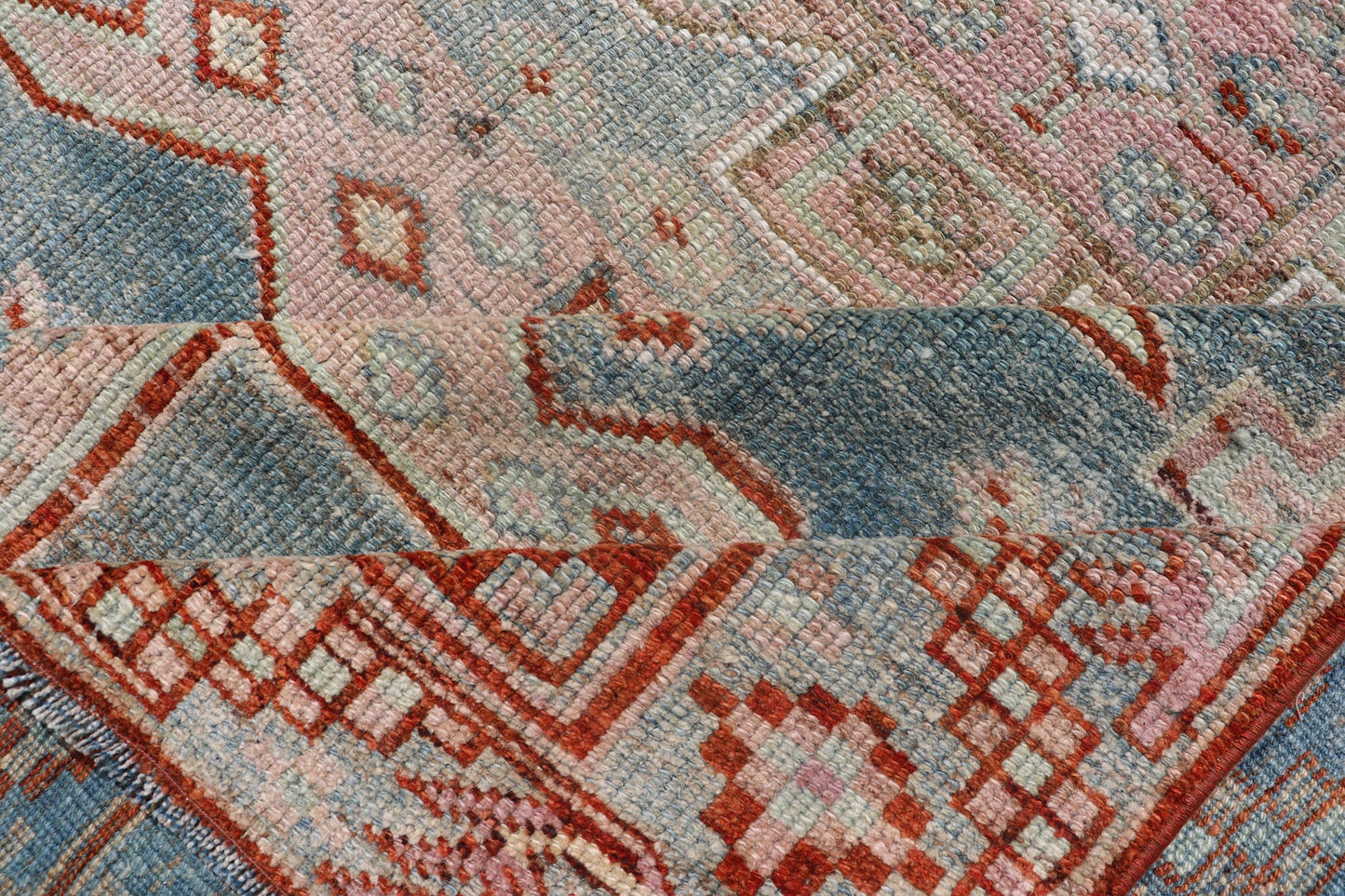 Persian Kurdish Antique Rug with Tribal Design in Light Blue, Teal, Taupe & Red Antique Kurdish rug with tribal geometric medallions in soft blue, pink, light blue, medium blue with hint of teal, brown, tape, salmon and red in the border. rug EM... - Keivan Woven ArtsEMB - 9509 - P13085 - 14620Rug